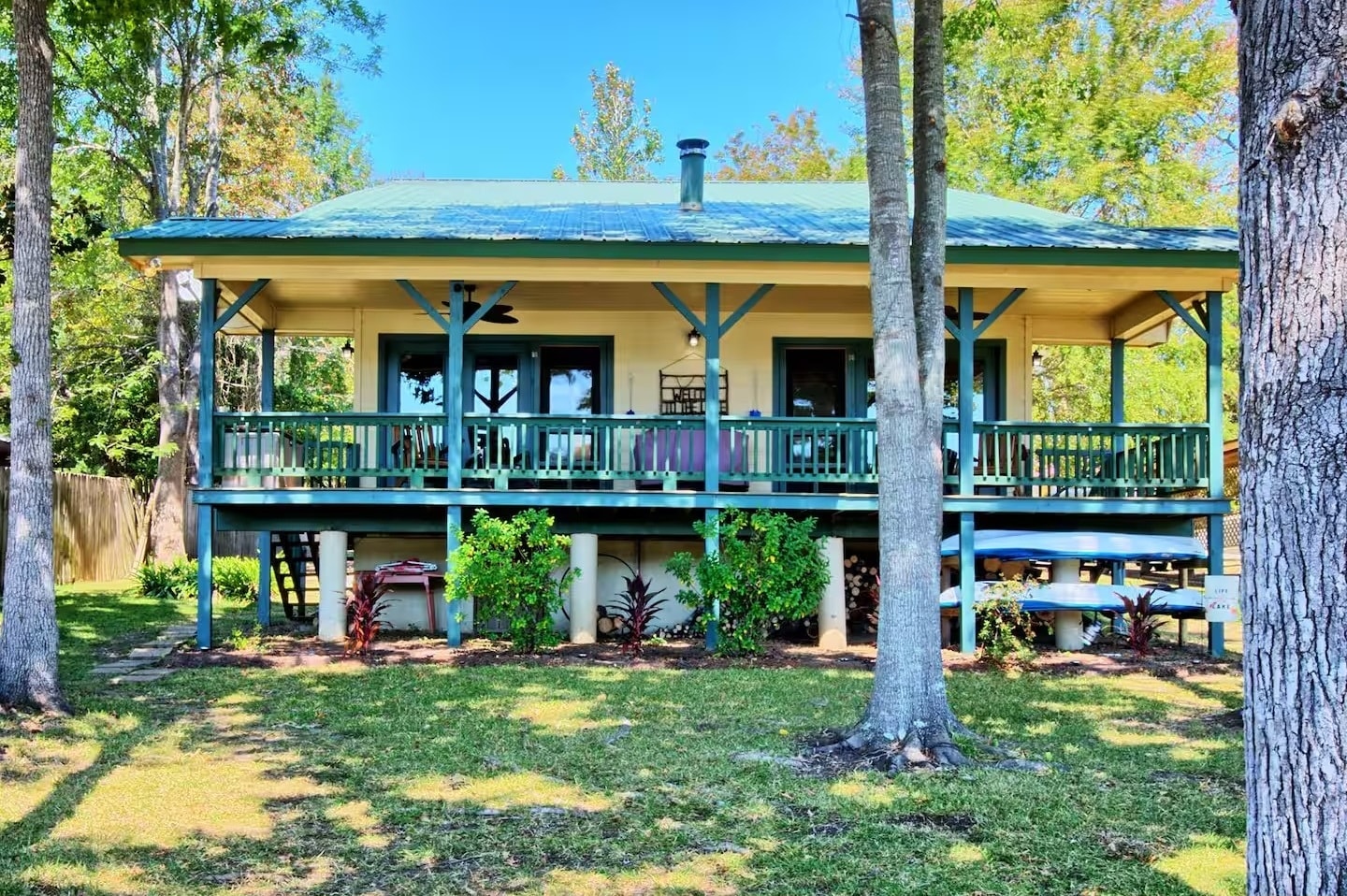 Lake house exterior with water view and deck